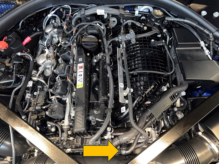 BMW 3.0L (S58) engine with arrow pointing to the Valvetronic actuator