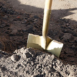 gold shovel dirt groundbreaking