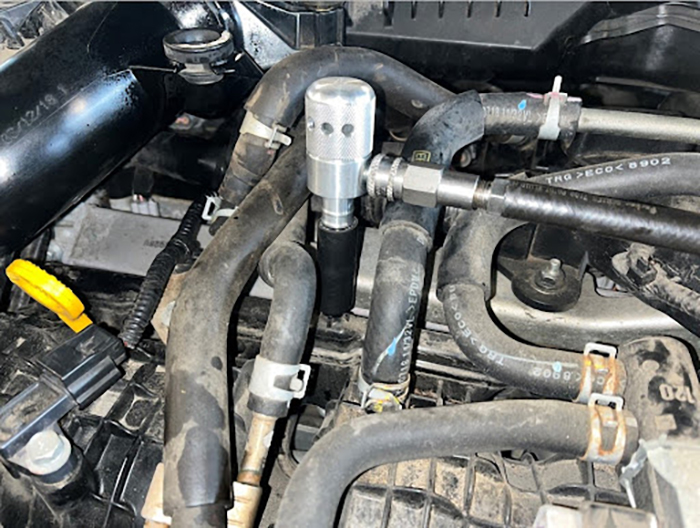 AE03 adaptor attached tot he vacuum port on the engine