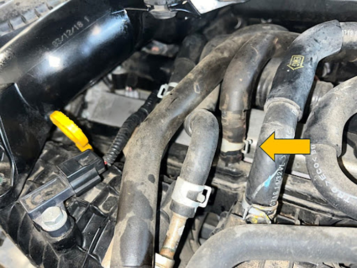 Close up location of vacuum port on Inifiniti/Nissan 2.0L turbo engine