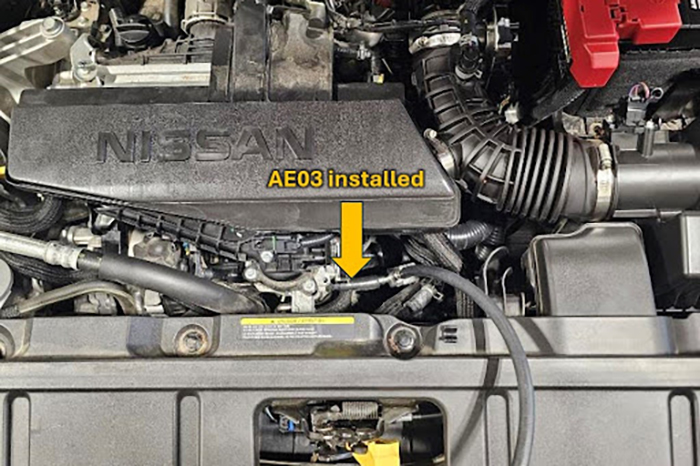Nissan 1.5L engine with the AE03 adaptor hose installed.