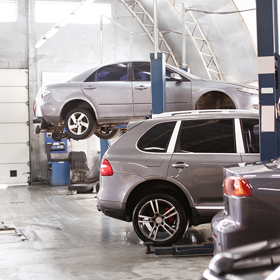 Interior of car service center with automobiles