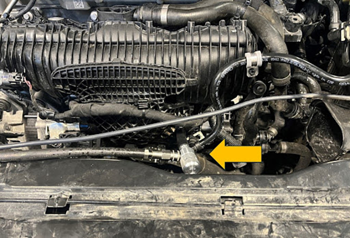 Engine showing the adaptor connected to the intake port.